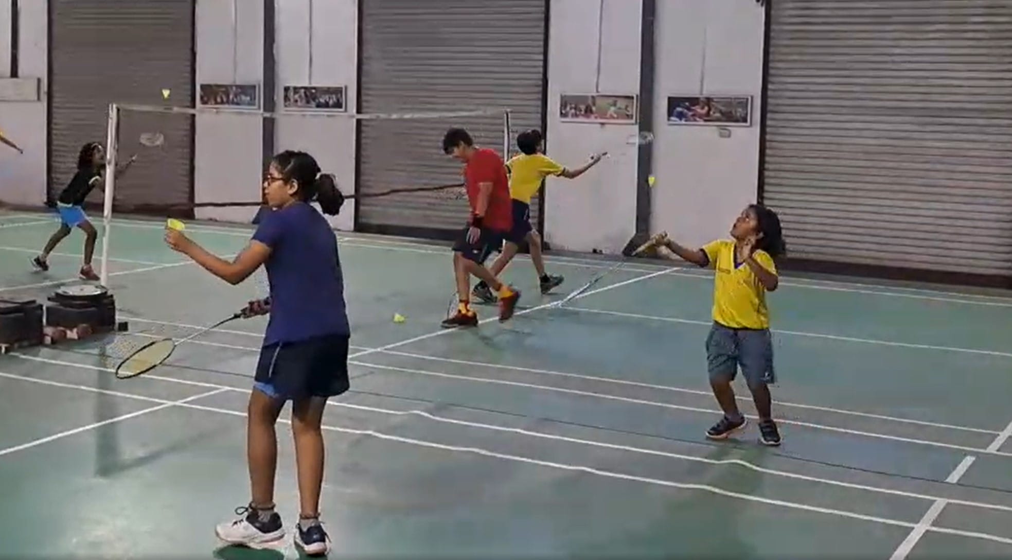 Bouncing shuttles working with young beginner players Badminton Andy